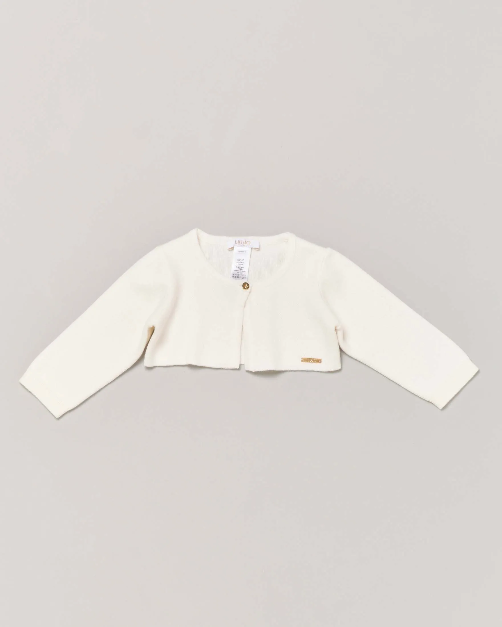 Bolero avorio in maglia di cotone con bottoncino e placchetta porta logo oro 9-48 mesi